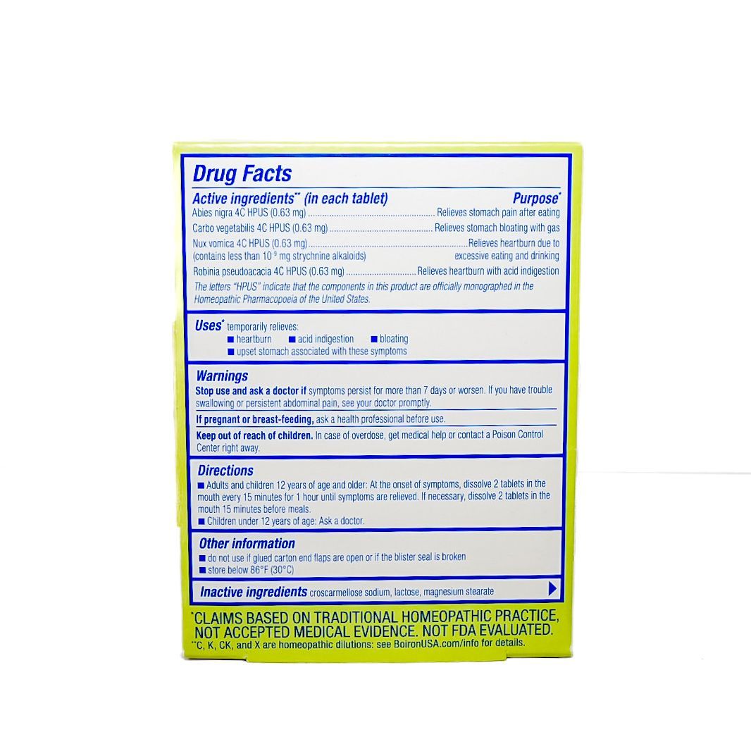 Green and white Acidiil antacid tablets box labeled “Heartburn Relief” and “Acid Indigestion”