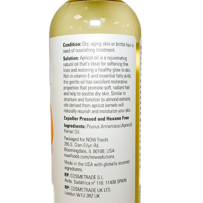 NOW Foods apricot oil bottle with apricot fruit illustration on a white background