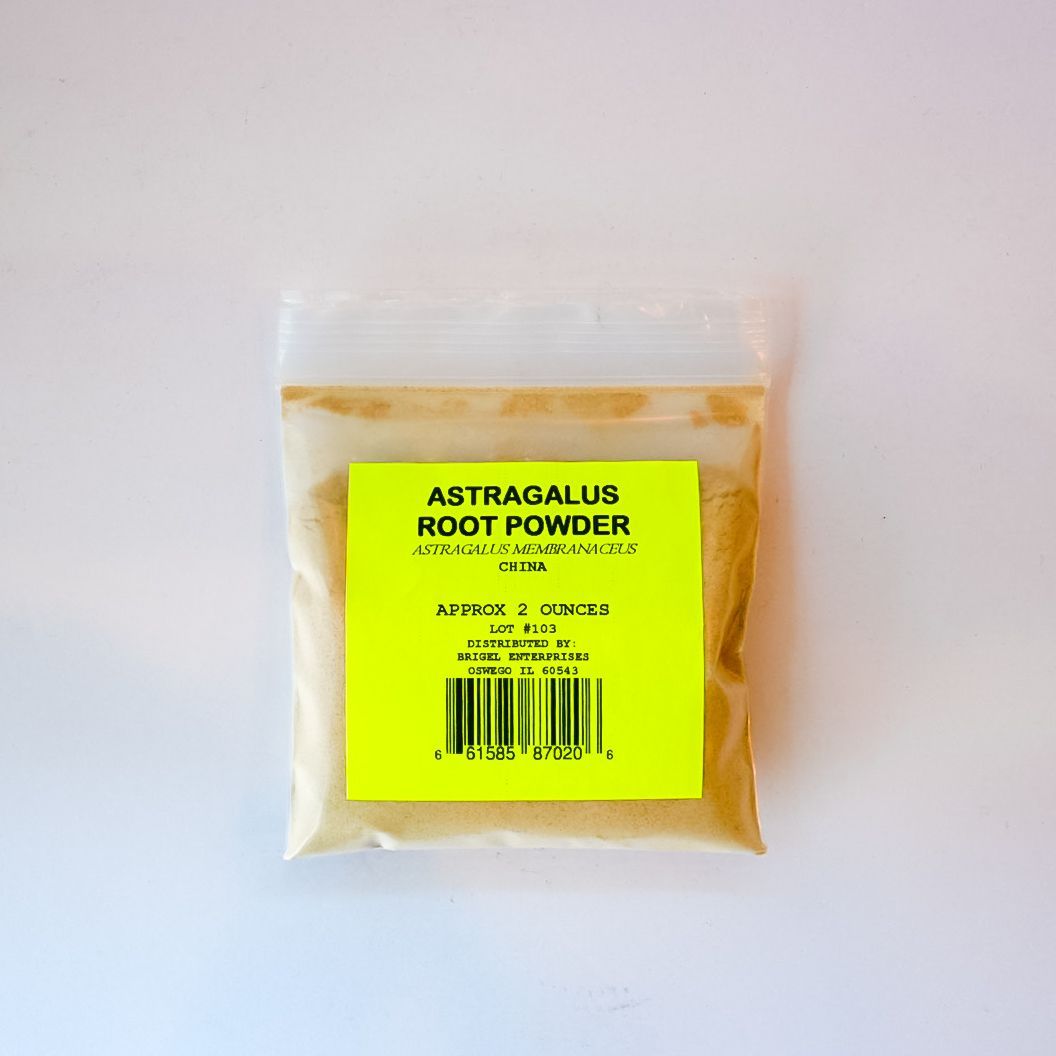Small clear plastic packet filled with yellow powder on a white background