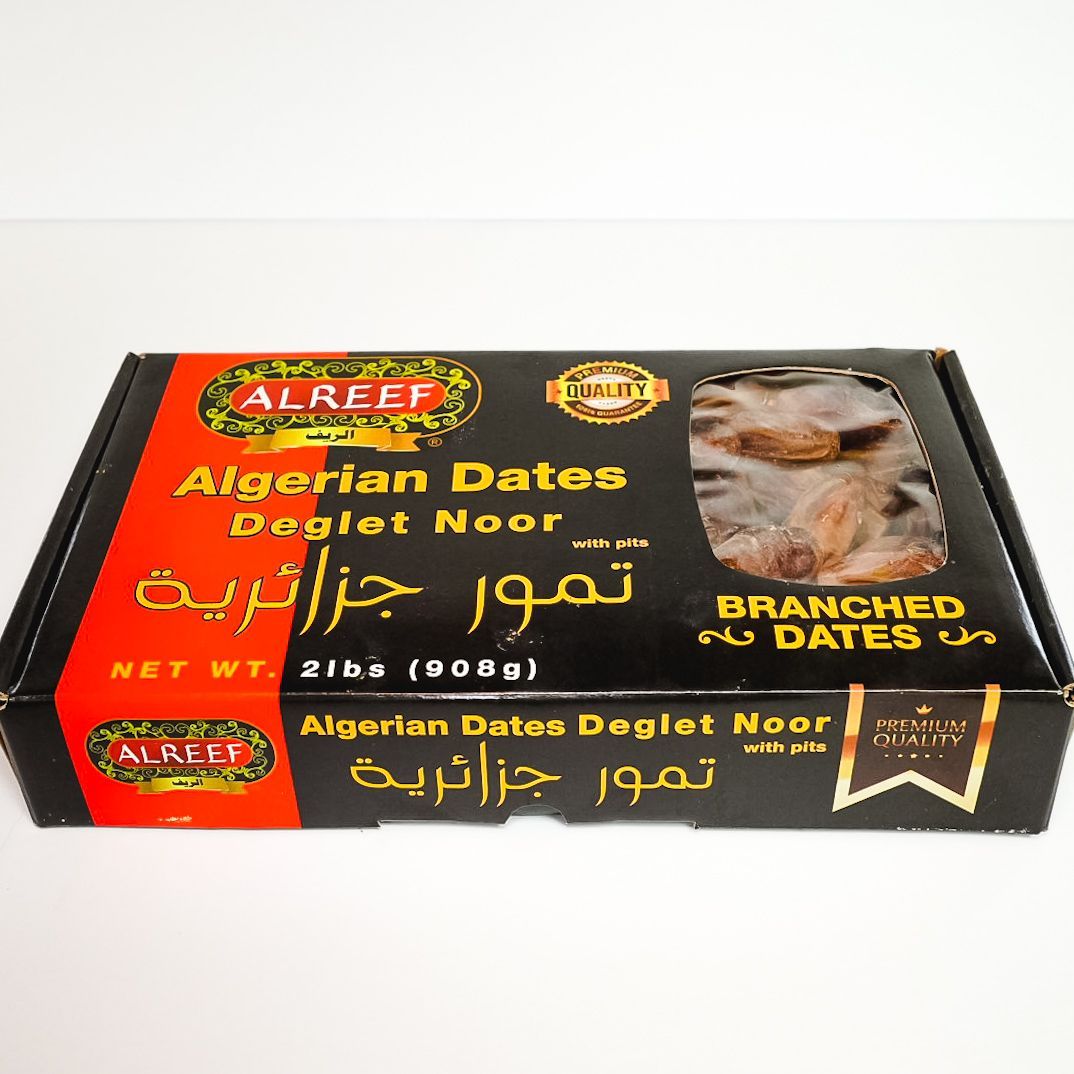 Black package of ALREEP Algerian dates with clear window showing dates and gold/red labeling