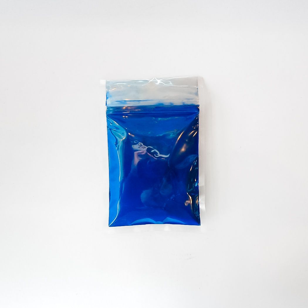 Blue packet with yellow label on a white background