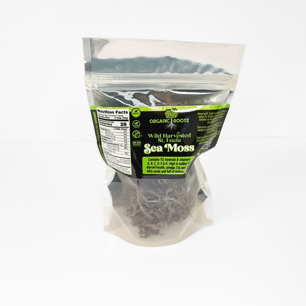 Clear plastic bag of packaged sea moss with green and black label on a white background