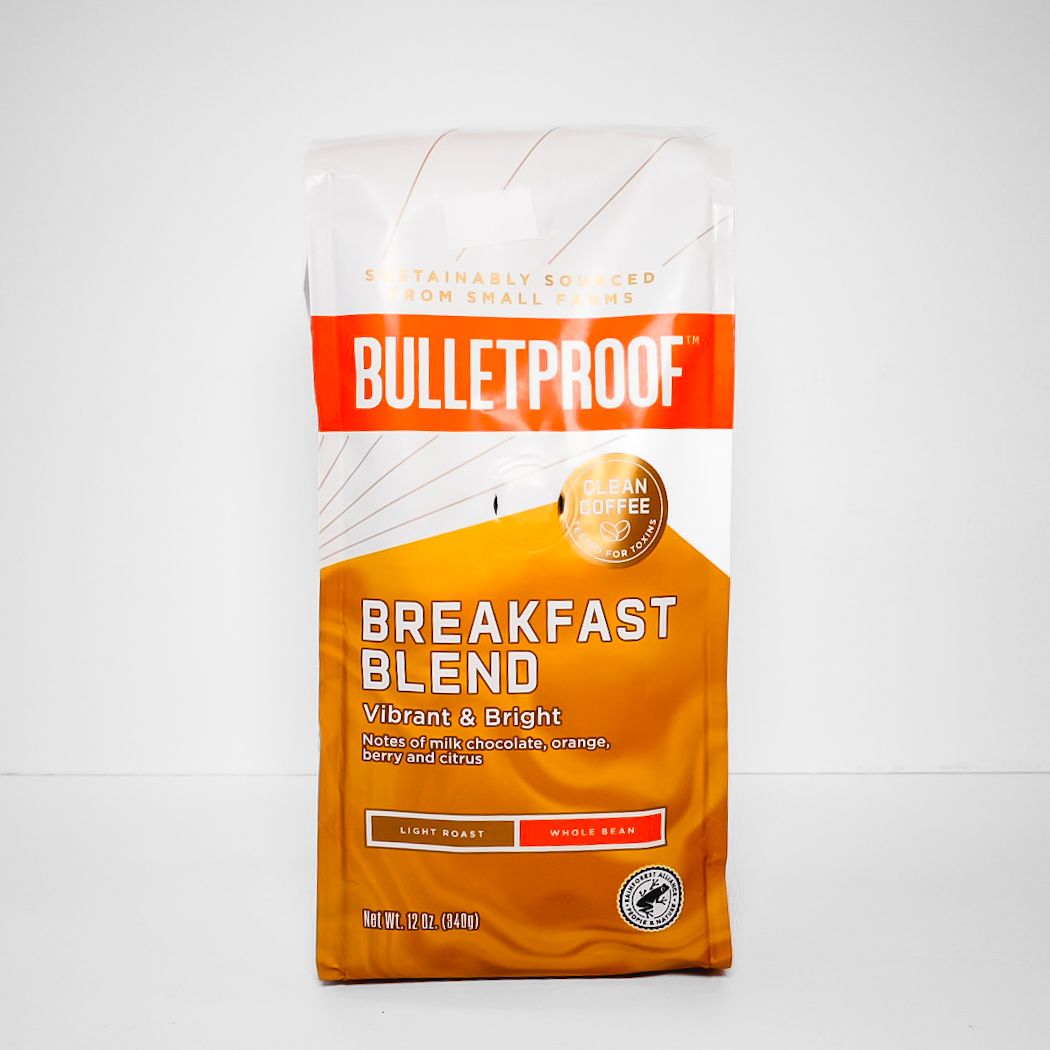 Bulletproof Breakfast Blend coffee bag with orange and white packaging on a plain background