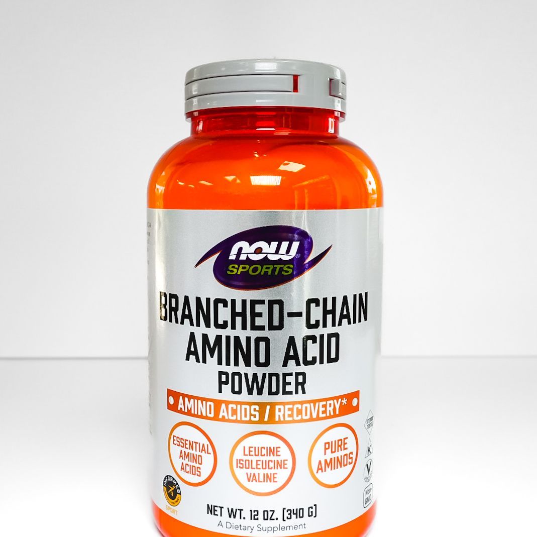 NOW Sports branched-chain amino acid powder bottle with orange cap and white label