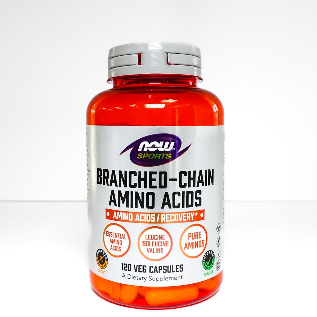 Bottle of NOW Sports branched-chain amino acids supplement with red cap and white label