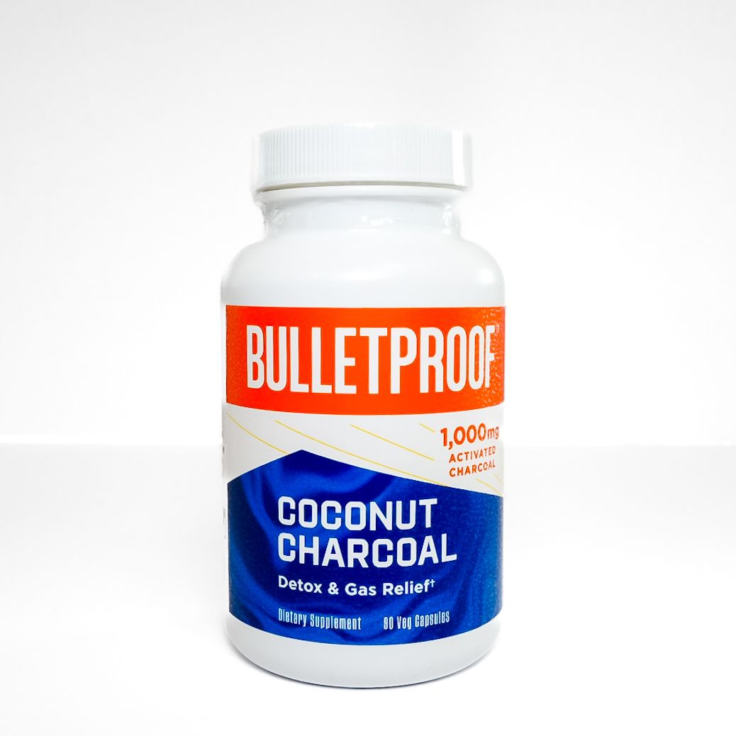 Bulletproof Coconut Charcoal coffee and gum powder bottle with orange and blue label