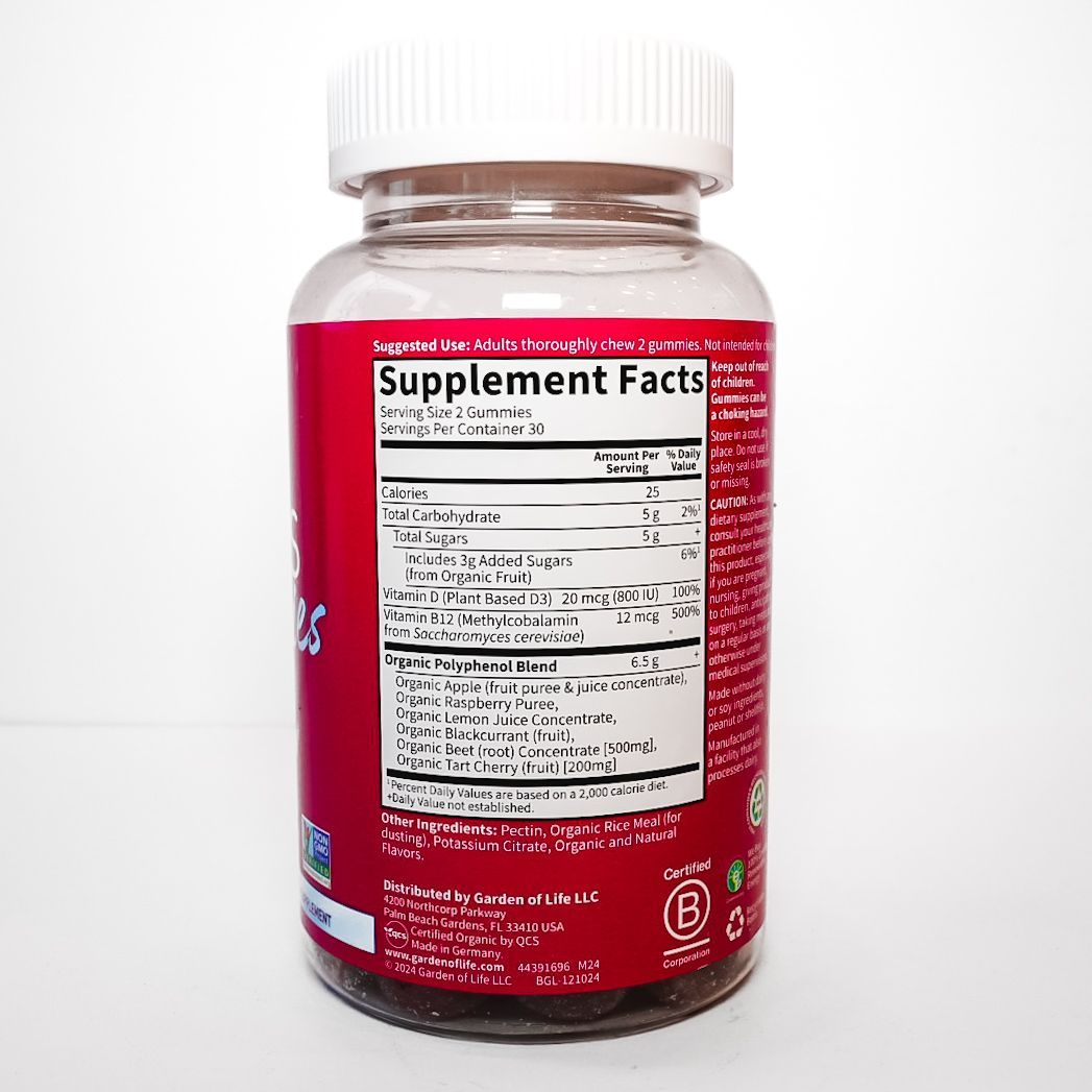 Red bottle of Beets Gummies supplement with white cap on a plain background