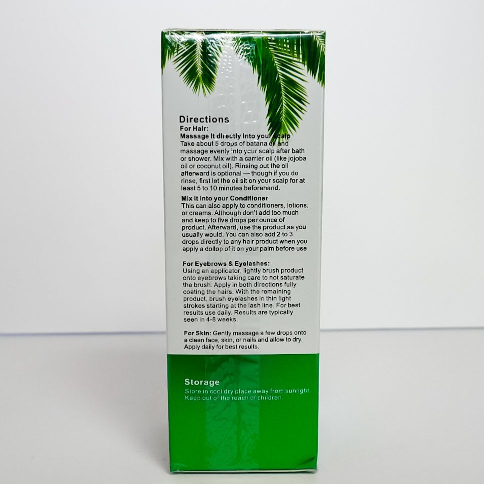Green Batana Oil hair care product box with fruit illustration and gold oil droplet.