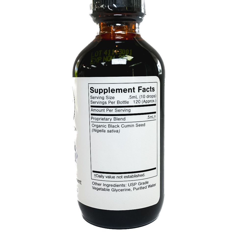 Amber dropper bottle labeled “Black Seed” with a white label and black cap on a white background