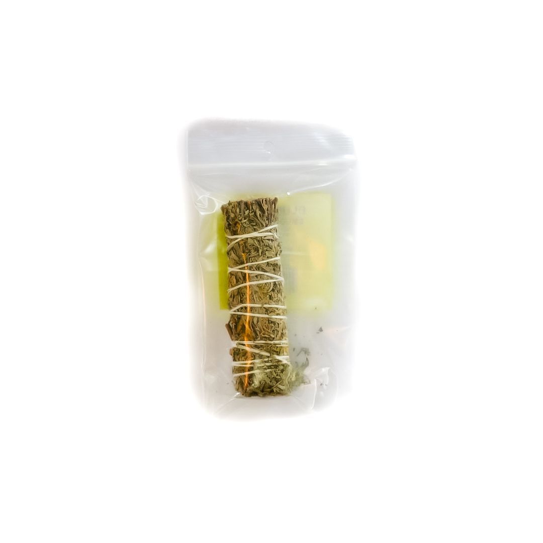 Wrapped blue sage bundle in clear plastic with a yellow label on a white background
