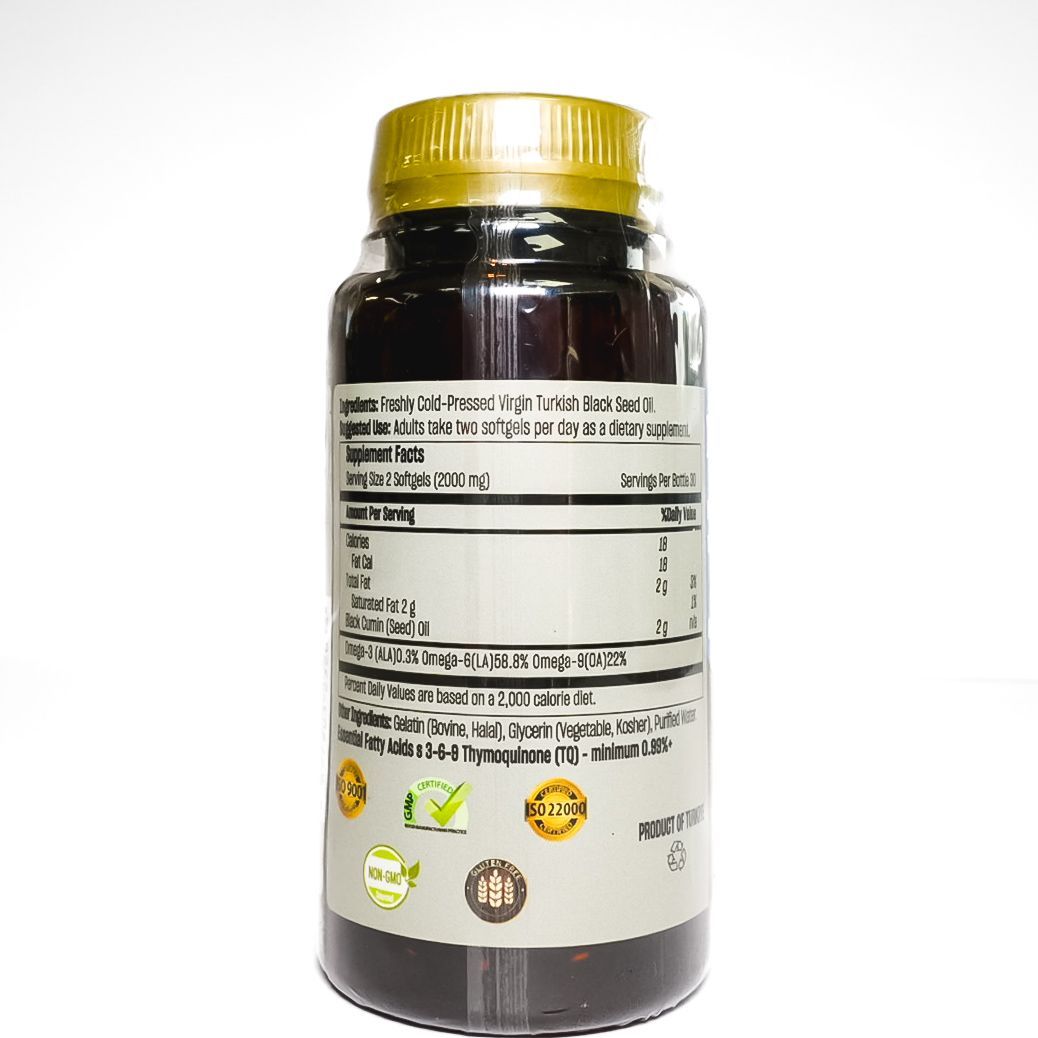 Black Seed black cumin seed oil bottle with blue label and gold cap on white background