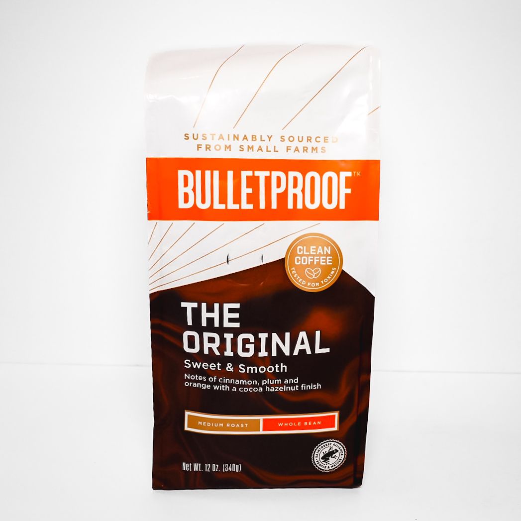 Bulletproof The Original coffee bag, white and dark brown with orange label, on a white background