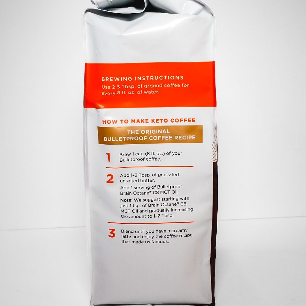 Bulletproof The Original coffee bag, white and dark brown with orange label, on a white background