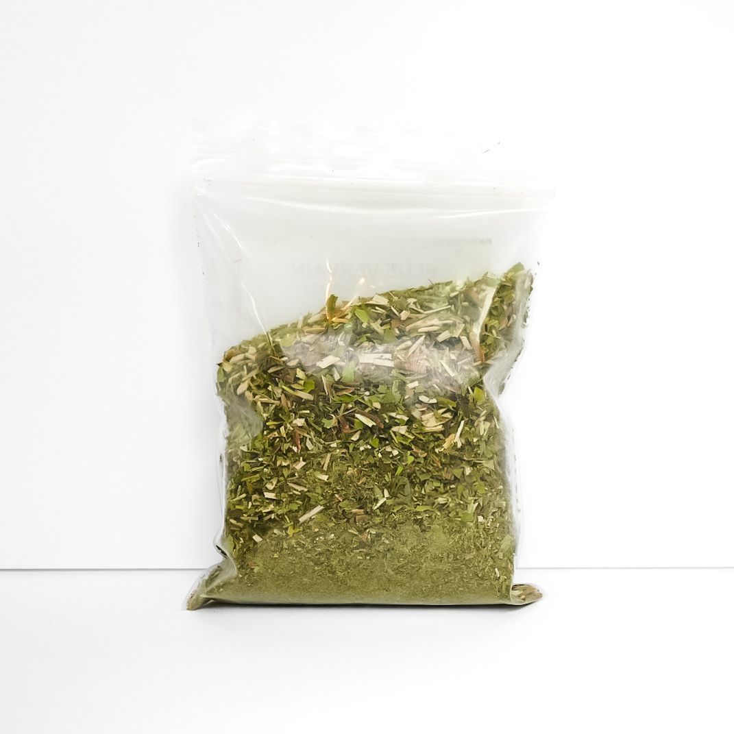 Clear plastic bag of dried blue vervain with a bright yellow label on a white background