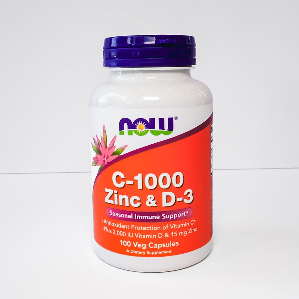 NOW C-1000 Zinc & D-3 dietary supplement bottle with purple cap on white background