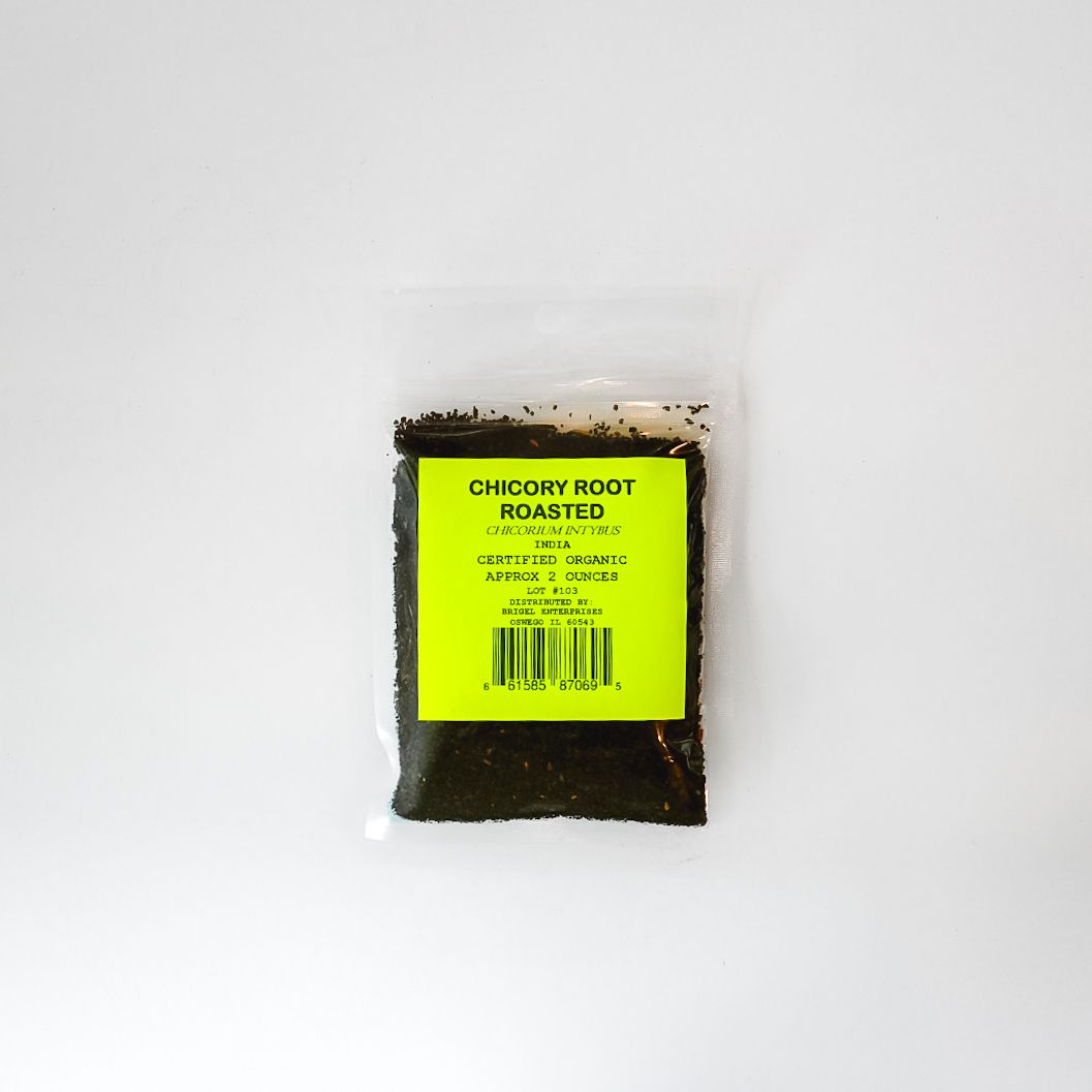 Small clear bag of roasted chicory root powder with a bright yellow label on a white background