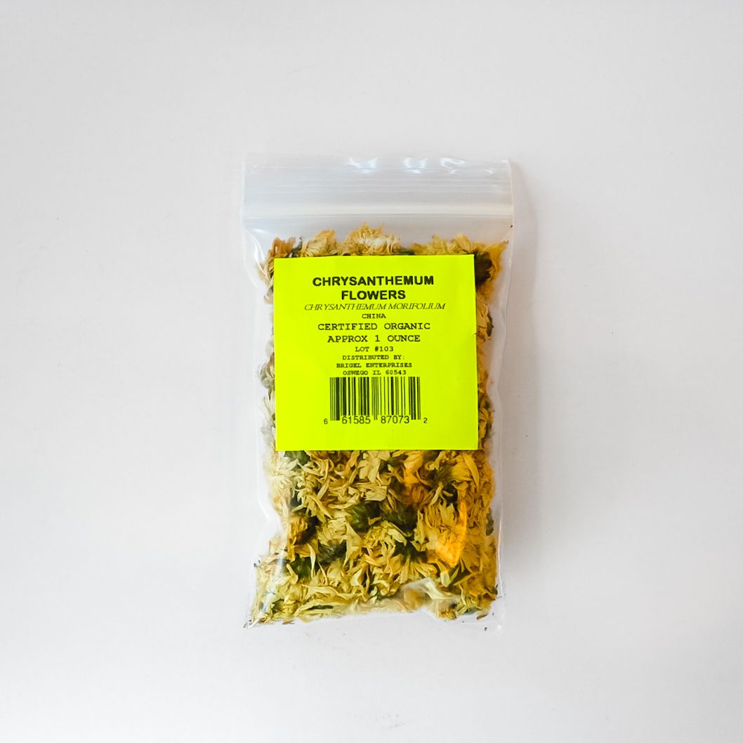 Small clear plastic bag of dried herbs with a bright yellow label and barcode on a white background