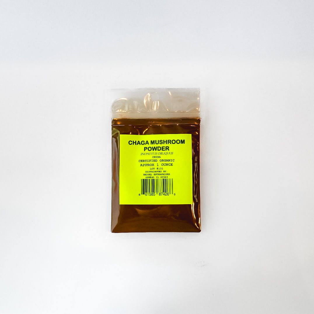 Small clear plastic bag with amber liquid and a bright yellow label on a white background