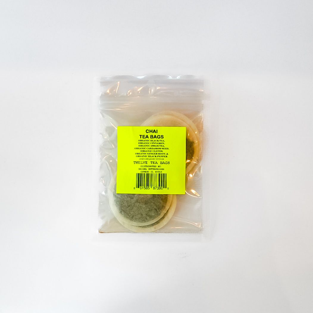 Clear plastic bag with a yellow label holding a round container on a white background