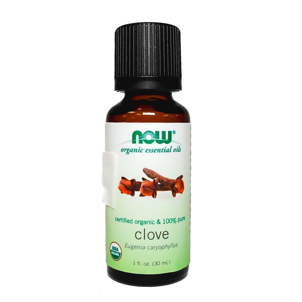 Bottle of NOW organic clove essential oil with black cap and green-white label