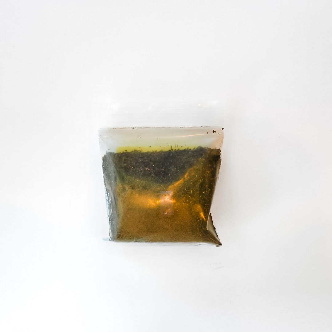 Small clear tea pouch with a bright yellow label on a white background.