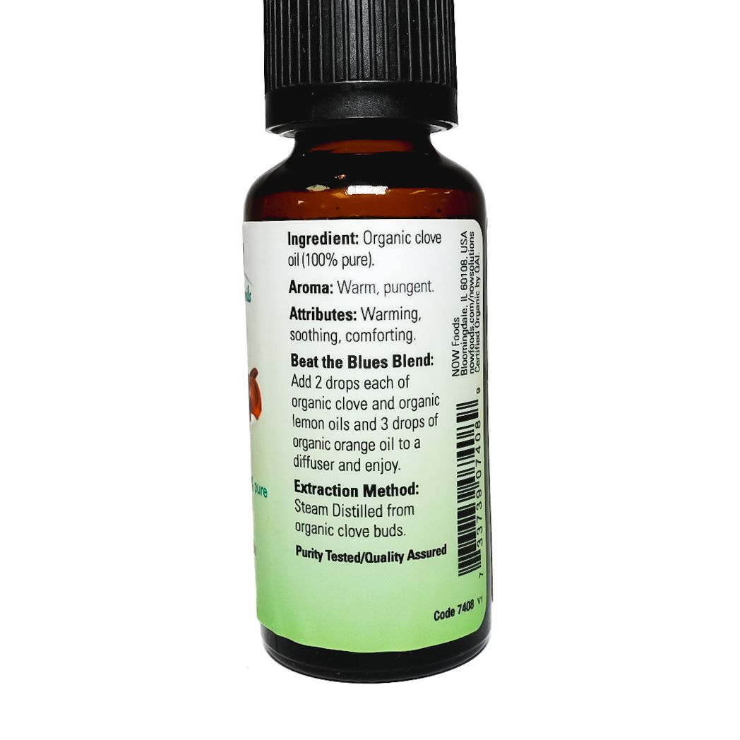 Bottle of NOW organic clove essential oil with black cap and green-white label