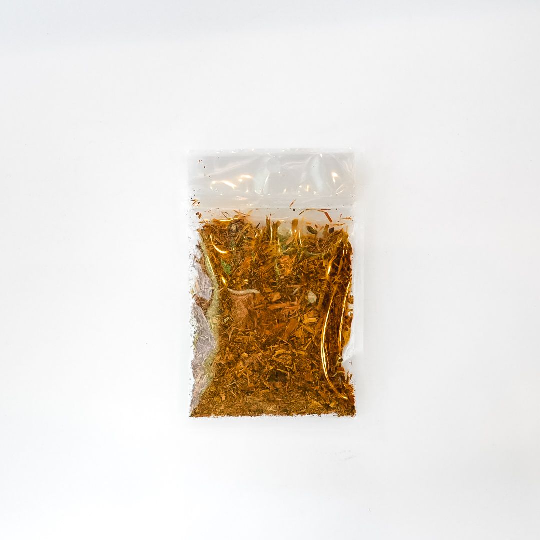 Small clear plastic pouch of cat’s claw bark with a bright yellow label on a white background