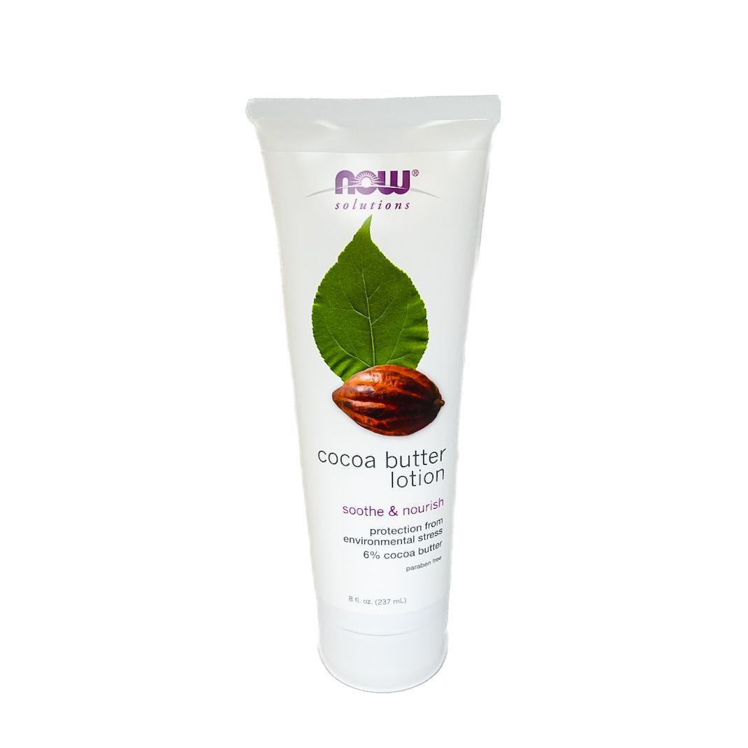 White cosmetic tube with green leaf and brown cacao pod label on a plain background