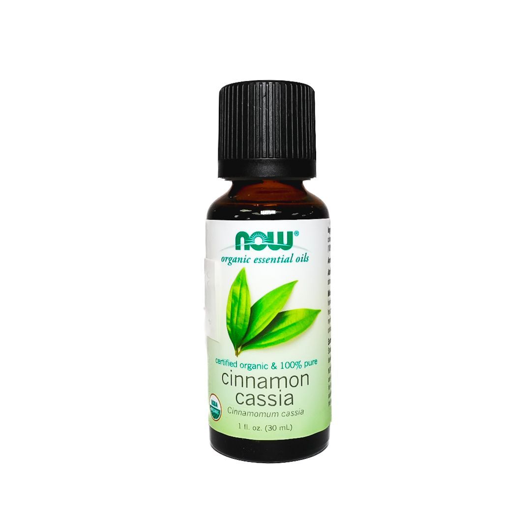 Small brown essential oil bottle labeled “Cinnamon Cassia” with a black cap and green leaf design