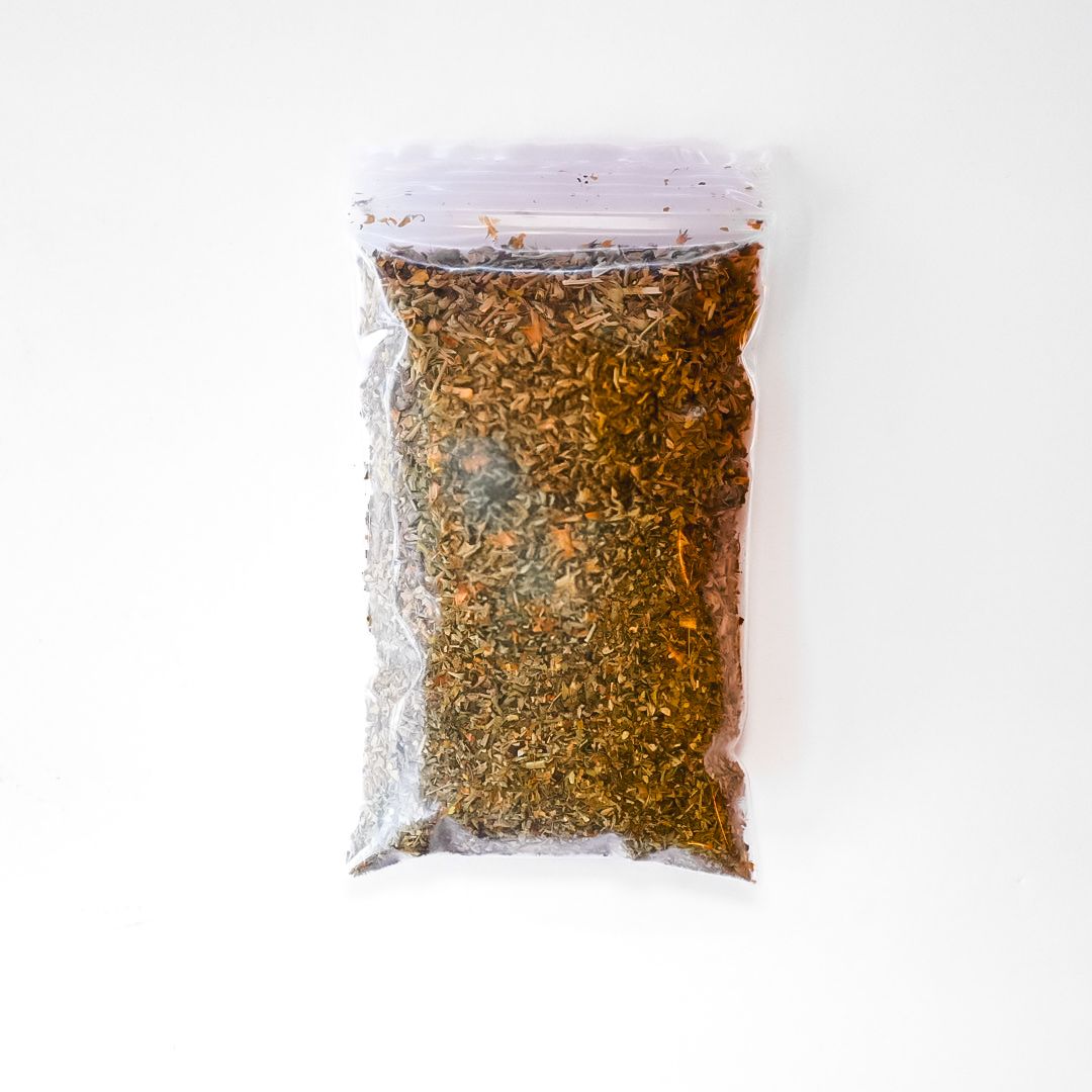 Plastic bag of dried catnip with a bright yellow label on a white background
