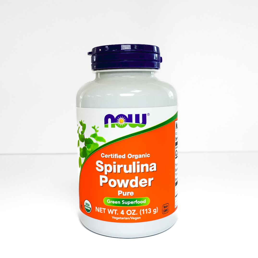 NOW Certified Organic Spirulina Powder bottle with orange label and dark blue cap
