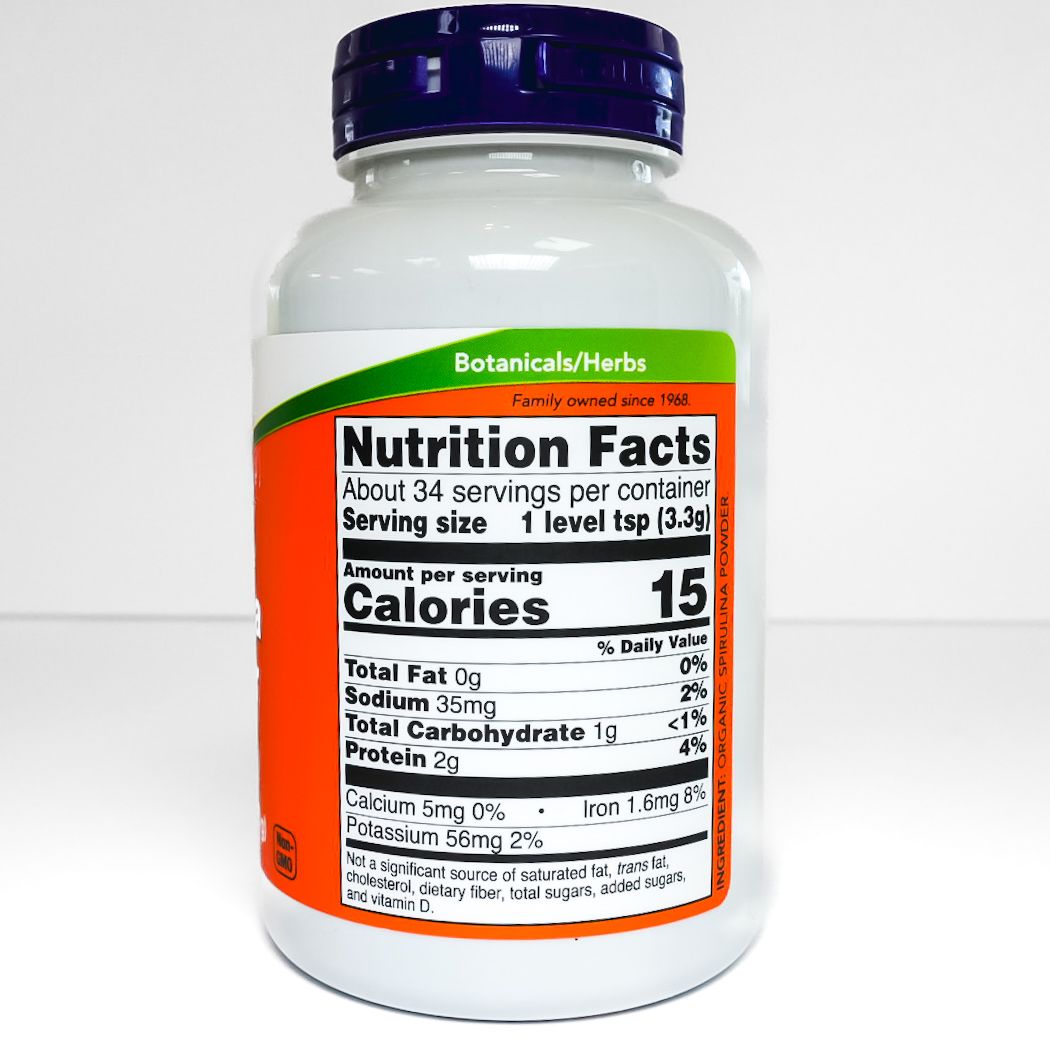 NOW Certified Organic Spirulina Powder bottle with orange label and dark blue cap