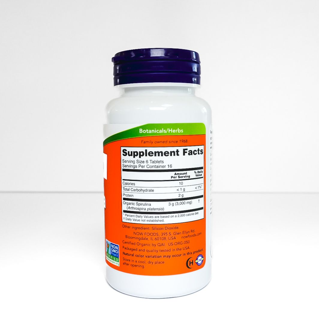 NOW certified organic Spirulina supplement bottle with orange label on white background