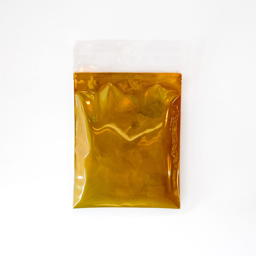 Clear plastic bag of golden-brown bark powder with a bright yellow label.