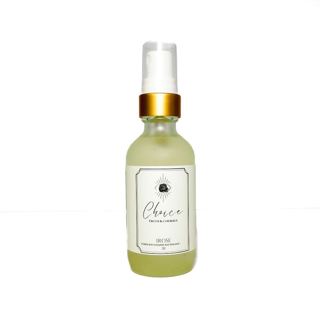Small frosted glass pump bottle with gold cap and white label on a white background