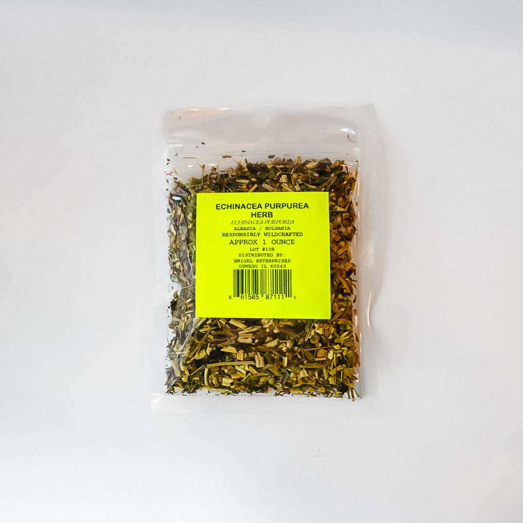 Small clear plastic bag of dried herbs with a bright yellow label on a white background