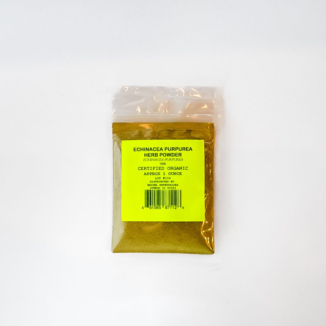 Small clear bag of yellow powder with a bright green label on a white background