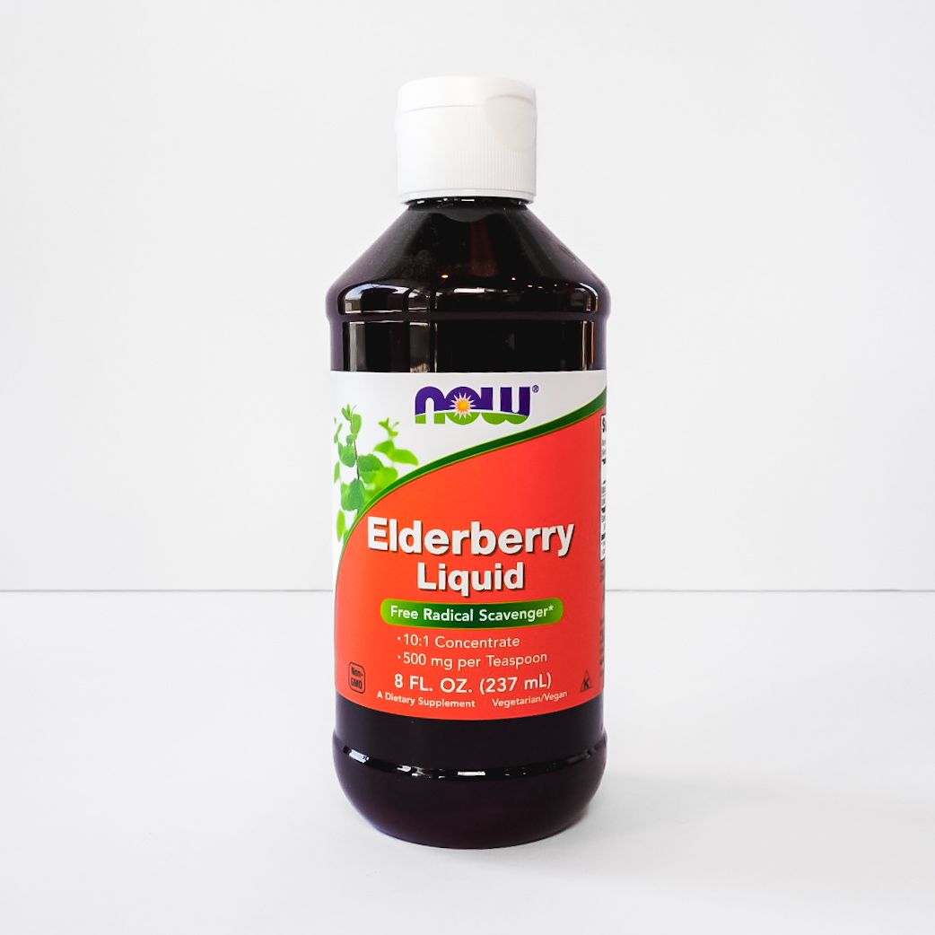 Bottle of NOW Elderberry Liquid supplement with red label and white cap on a plain background
