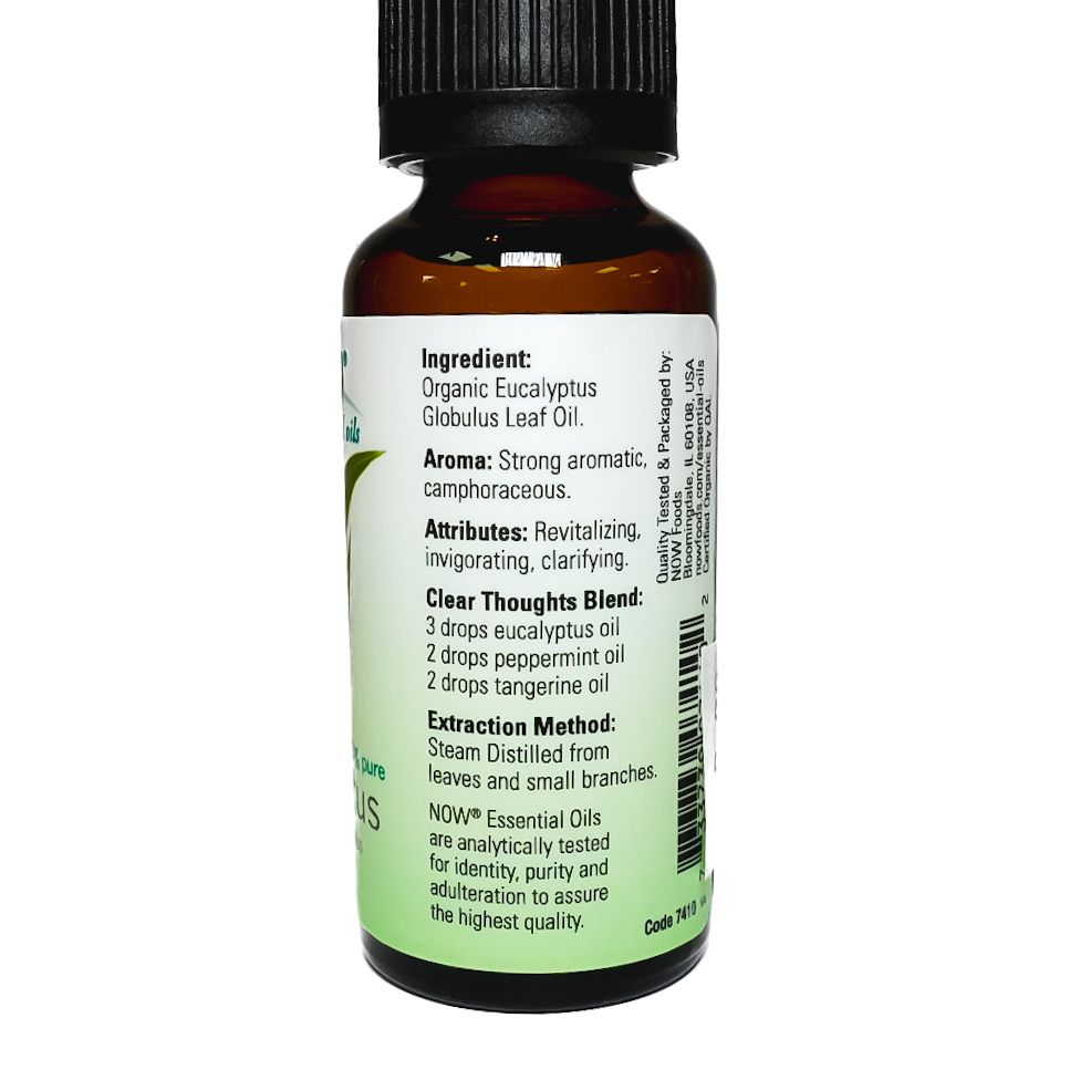 Bottle of NOW eucalyptus essential oil with green label and black cap