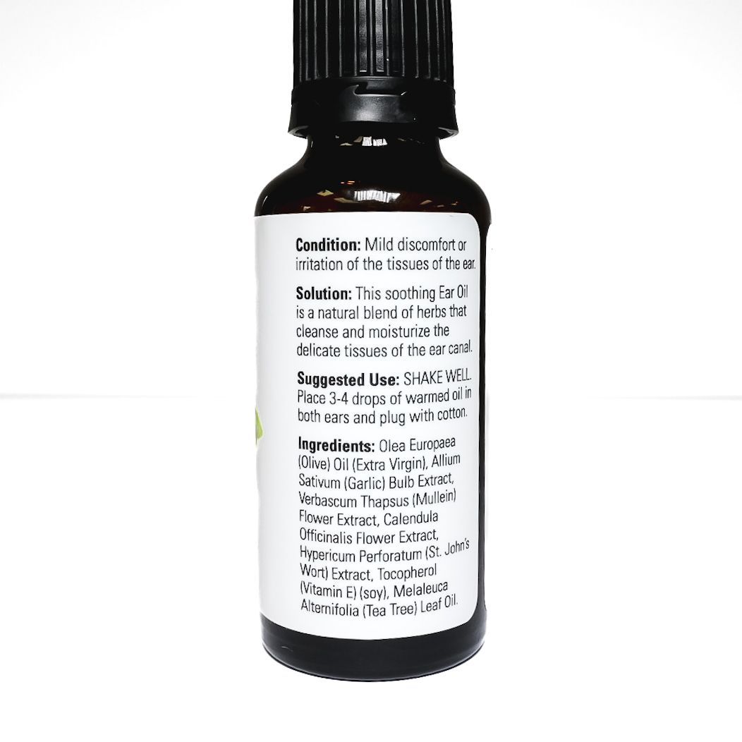 NOW ear oil bottle with black dropper cap and green herbs on a white background