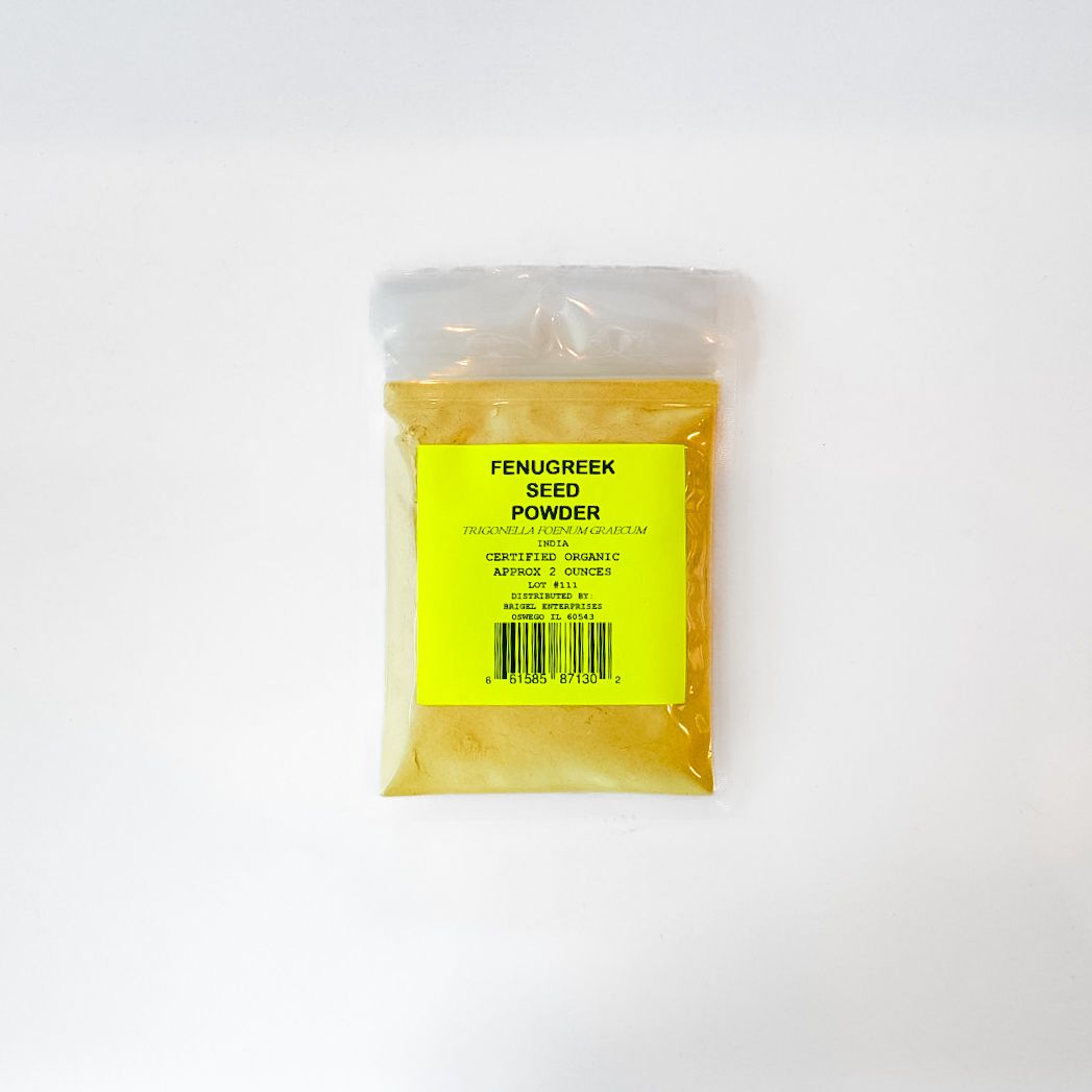 Small clear plastic bag of yellow powder with a bright yellow label on a white background
