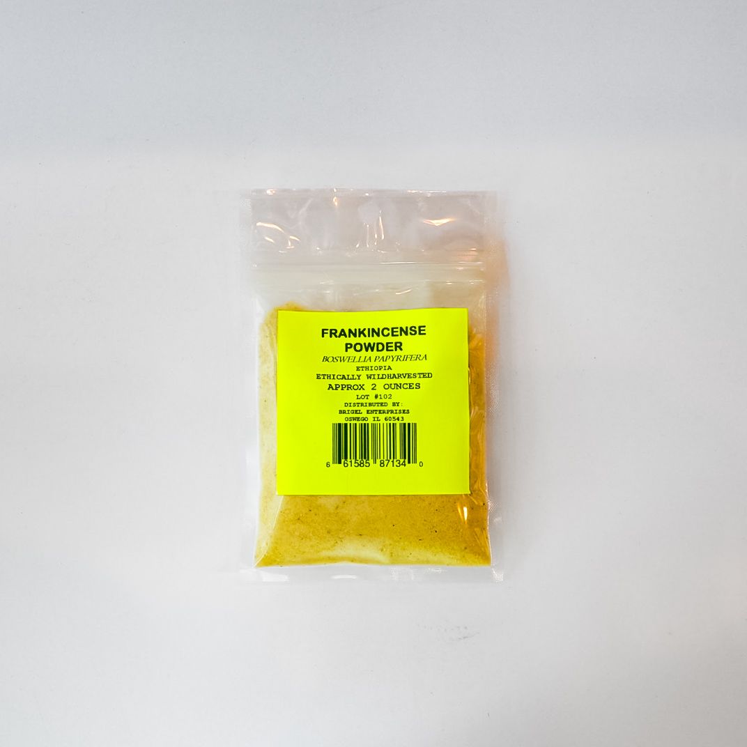 Small clear plastic packet with yellow powder and a bright yellow label on a white background