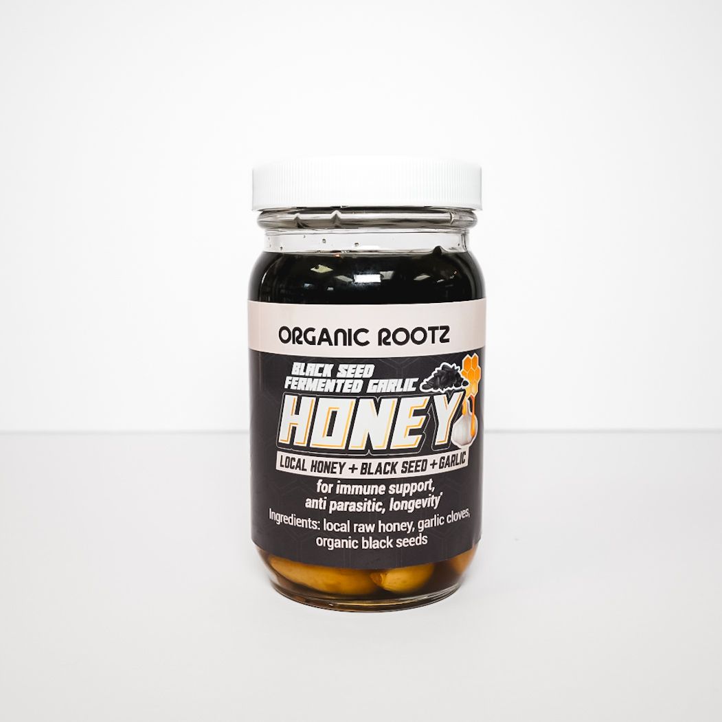 Small jar of Organic Rootz “Kidney” supplement with black-and-white label on a white background