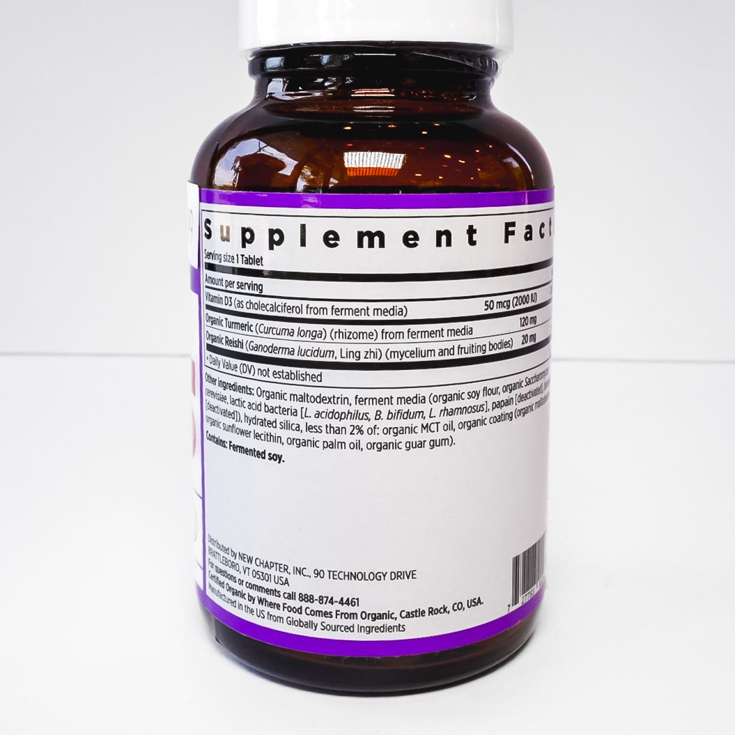Brown vitamin D3 supplement bottle with white cap and purple label on a white background