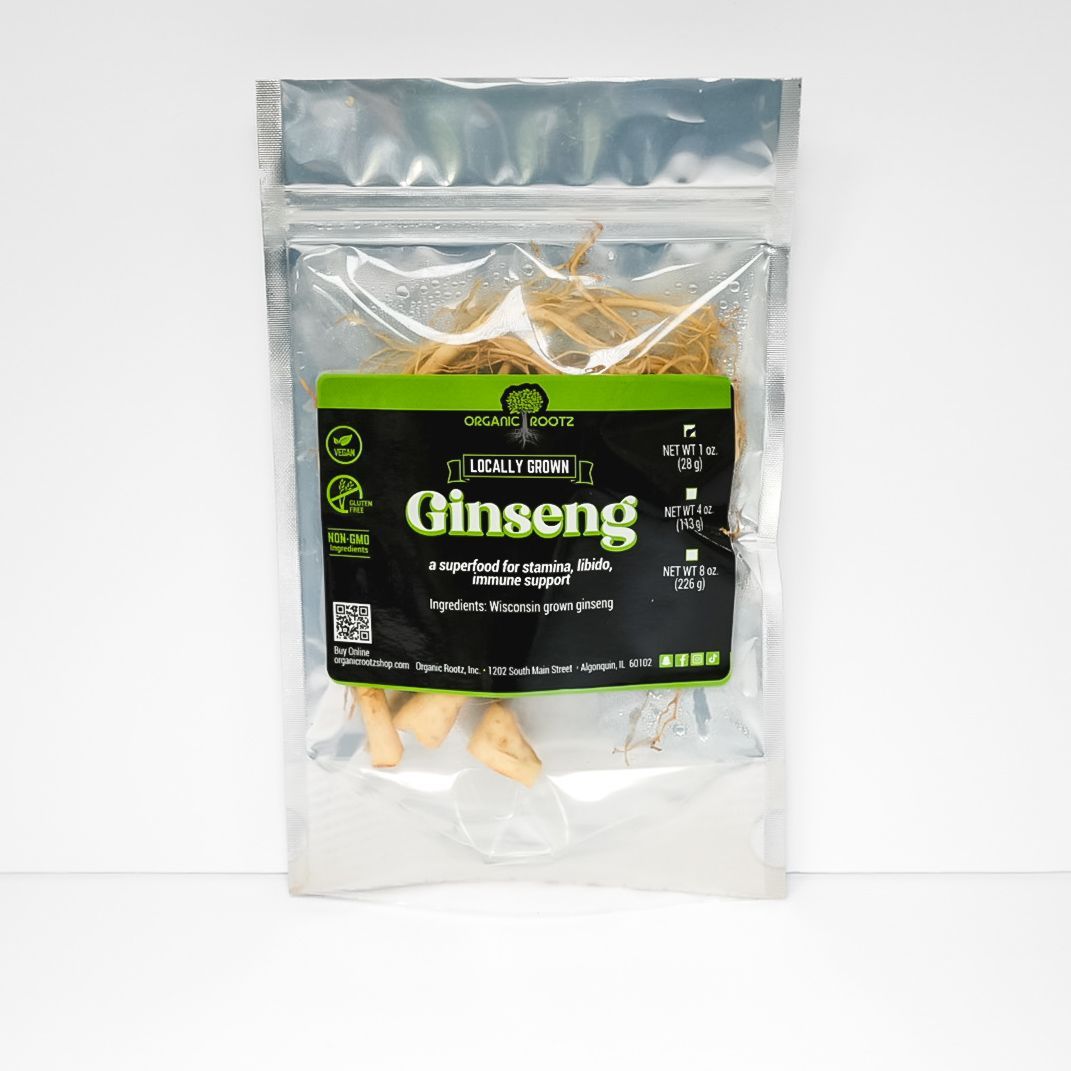 Clear resealable bag of dried ginseng roots with a black-and-green label on a white background