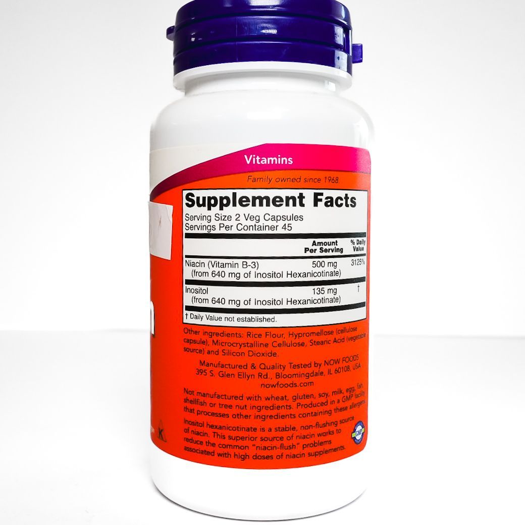 Bottle of NOW Flush-Free Niacin 250 mg supplement with white and orange label and purple cap