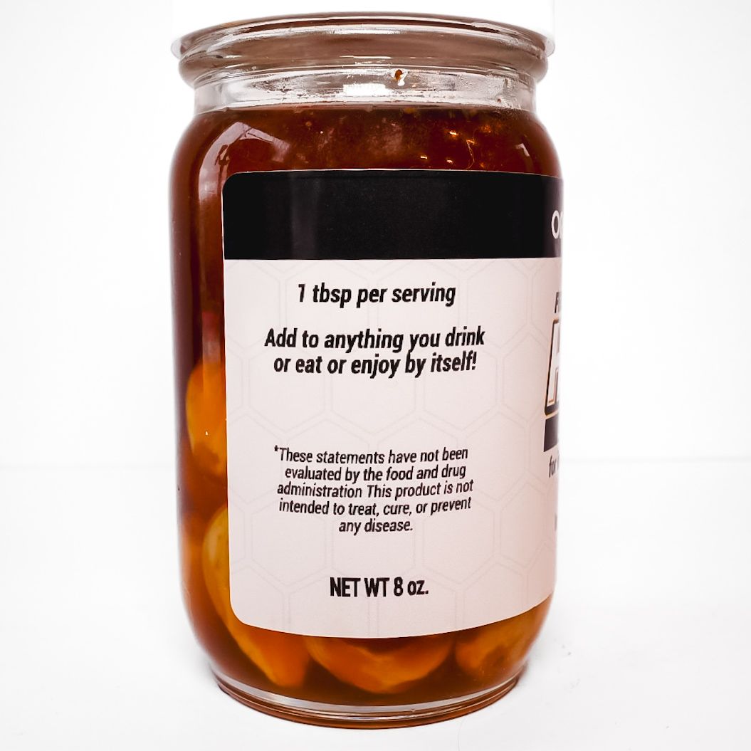 Jar of Organic Rootz fermented local honey with garlic and herbs, white label and cap