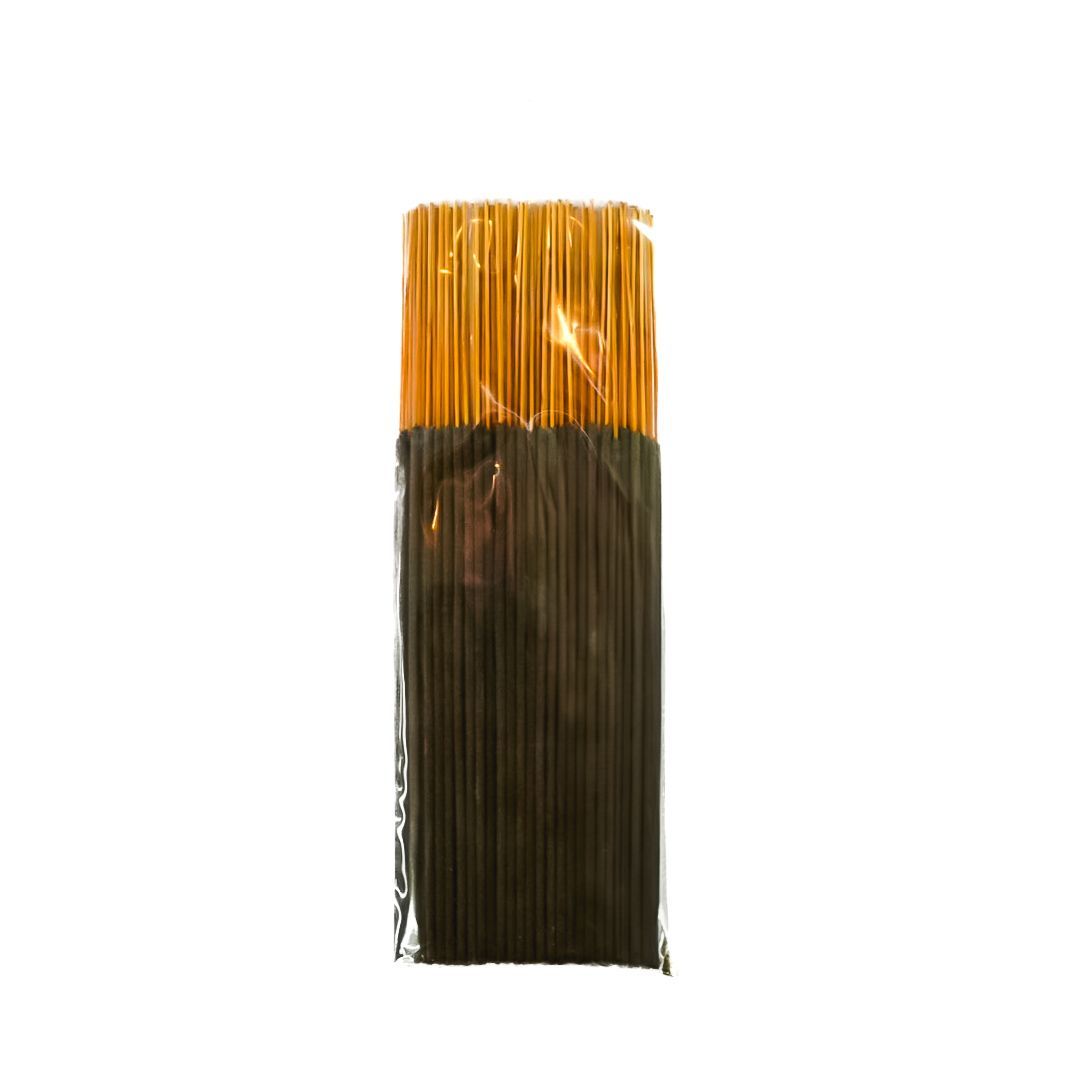Packaged black incense sticks with a bright yellow label and clear plastic wrapping