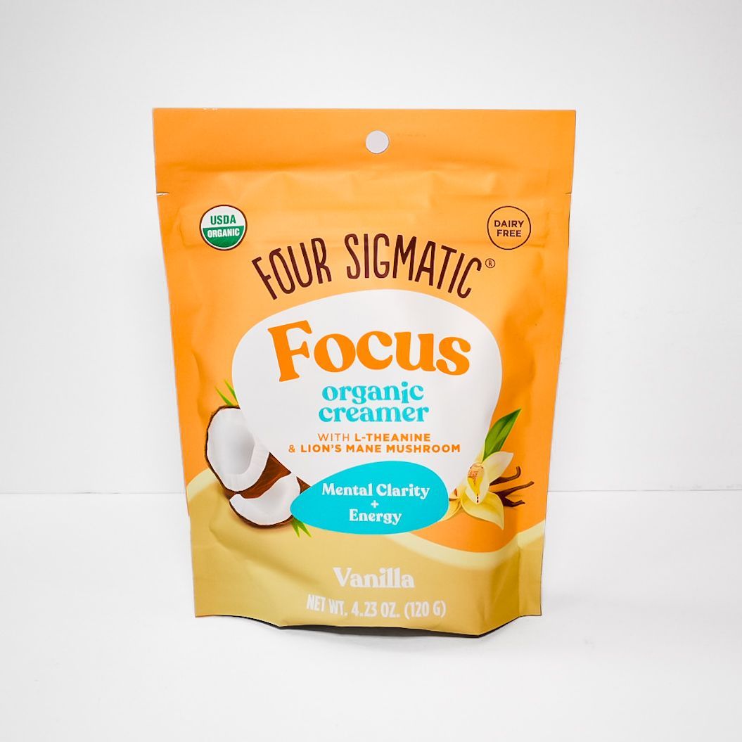Orange pouch of Four Sigmatic Focus organic coffee creamer, vanilla flavor, on a white background