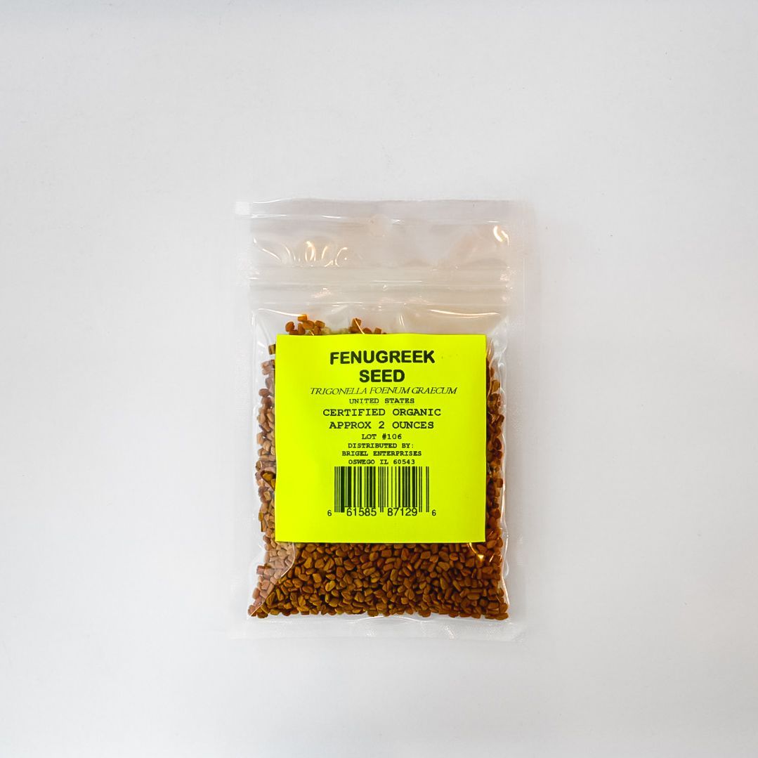 Small clear bag of fenugreek seed with a bright yellow label on a white background